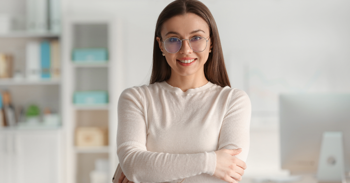 Woman-rebranding happy woman with arms crossed