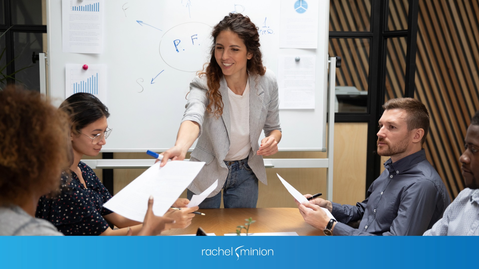 A CMO working with a whiteboard behind