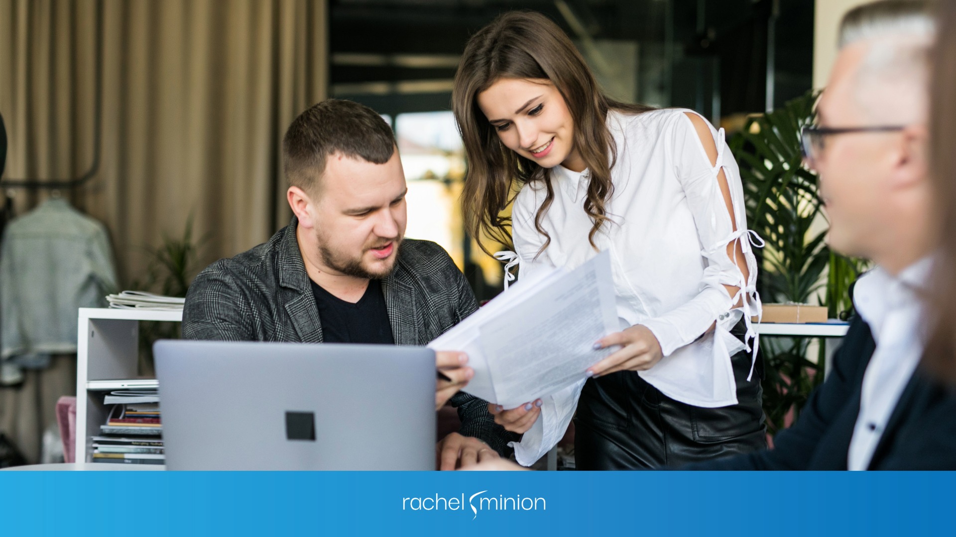 A marketing consultant reading a report